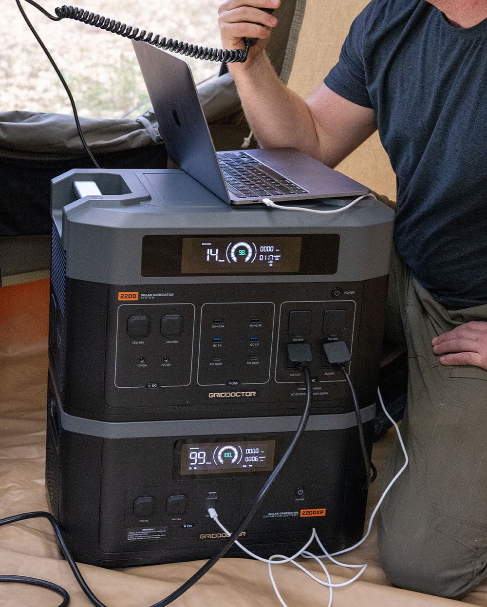 Image of a laptop connected to the emergency solar power system, highlighting the practical use of renewable energy for running electronic devices