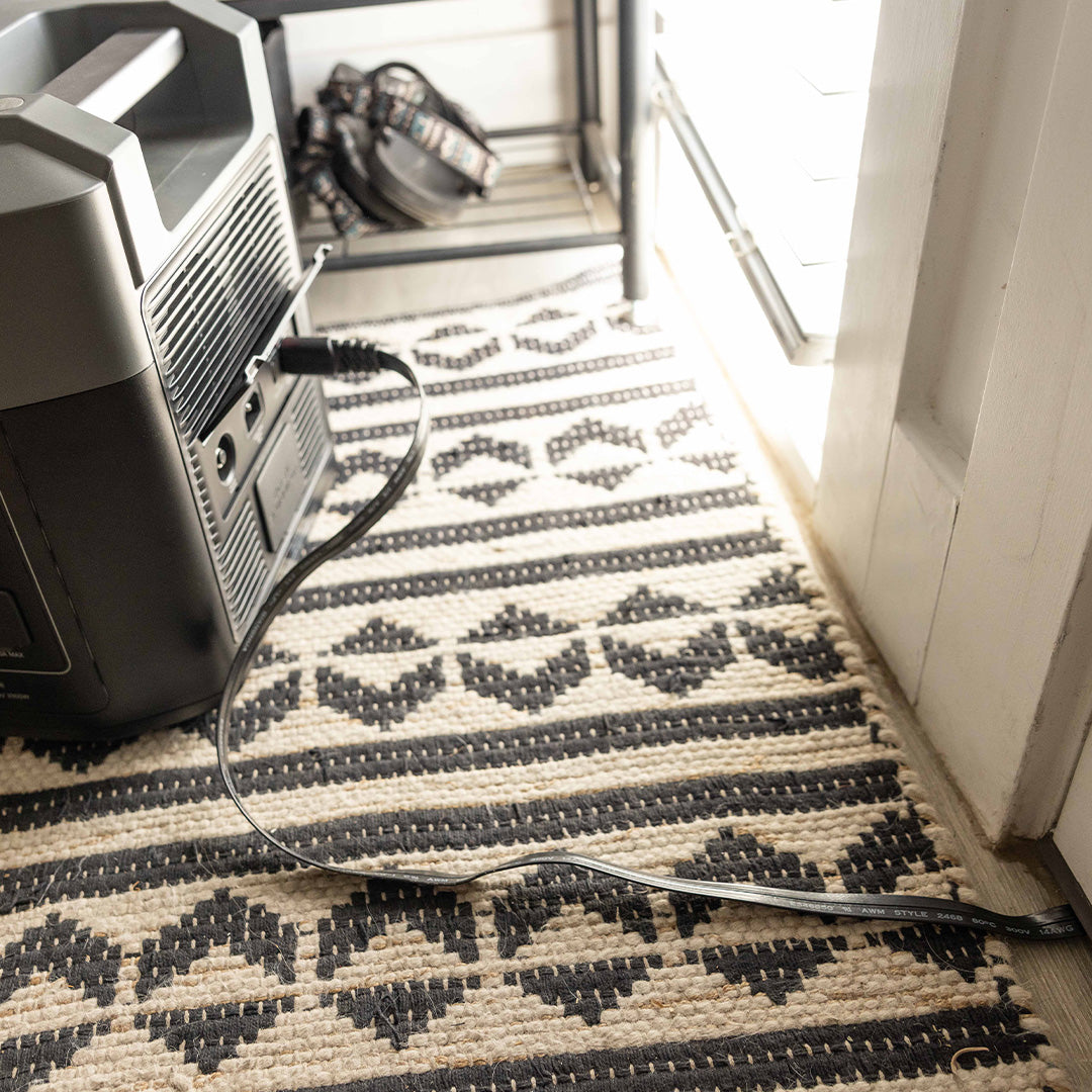 Extension cord passing through a doorway for the 2200 & 3300 Solar Generators by Grid Doctor